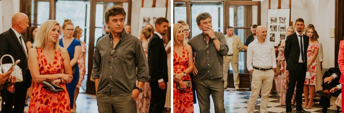 Grupa ludzi na eleganckim spotkaniu w galerii sztuki.